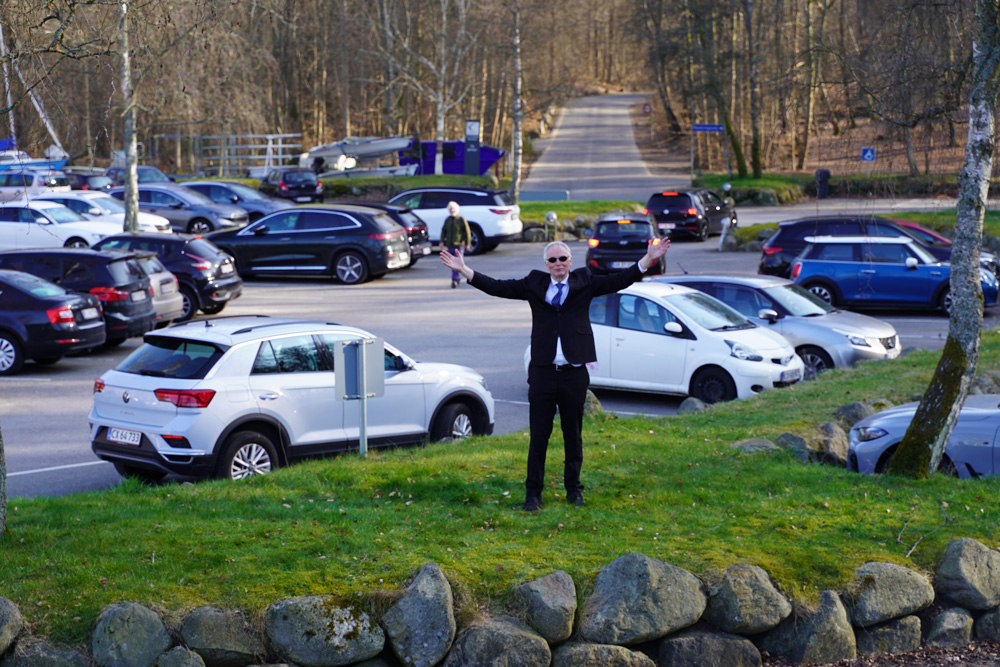 Christian Halken, actor and host of the Greenpeace campaign Tourism Denmark, shows a motorway at Furesø, which is part of Denmark's NATURA 2000 protected areas.